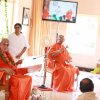 Swamiji listening to Nutan Swamiji's words